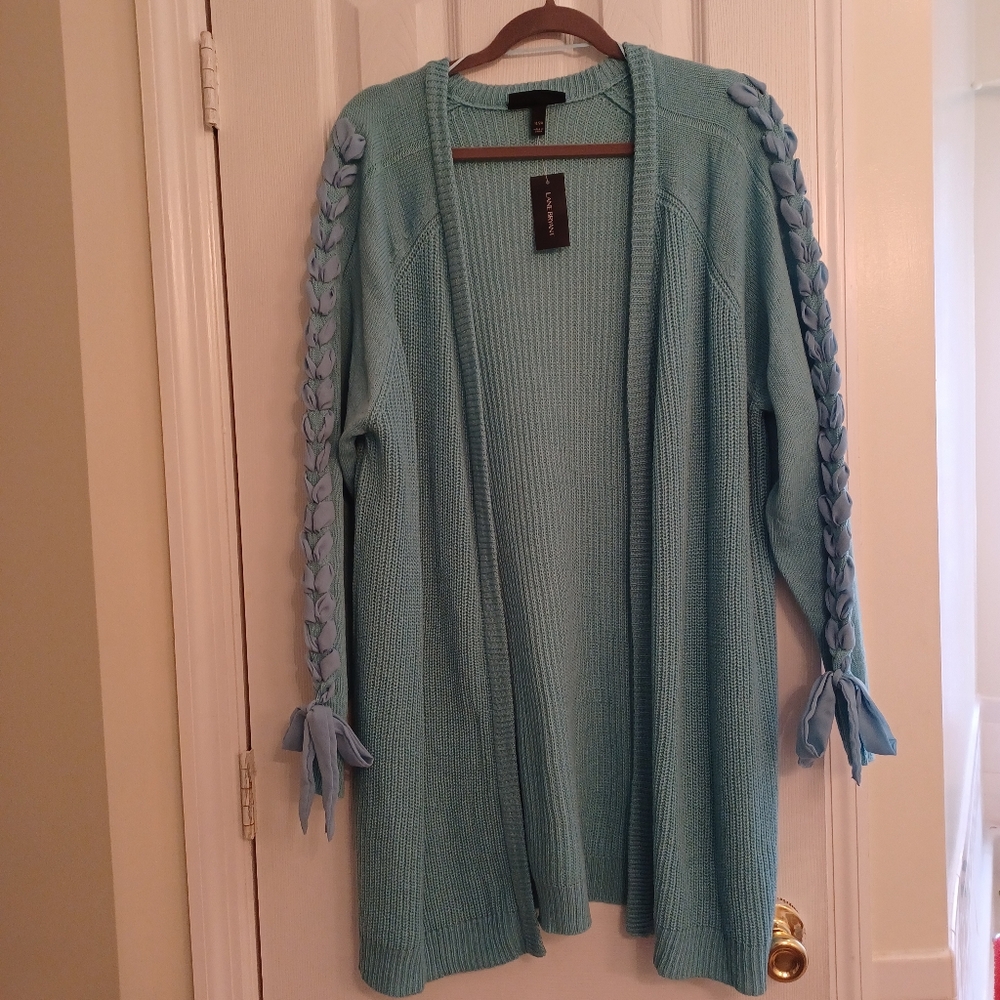 Lane Bryant aqua long cardigan sweater with braided fabric along the sleeves .